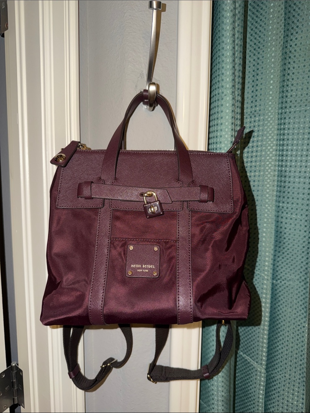 henri bendel burgundy backpack with gold hardware